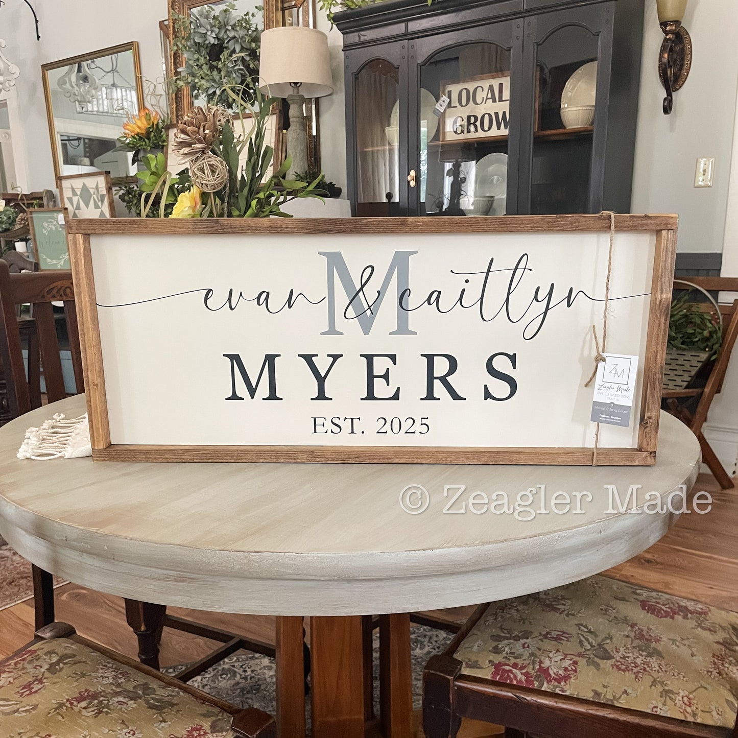 Established Sign with first names over last initial